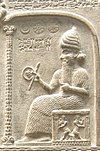 Representation of Shamash from the Tablet of Shamash (c. 888  855 BC), showing him sitting on his throne dispensing justice while clutching a rod-and-ring symbol